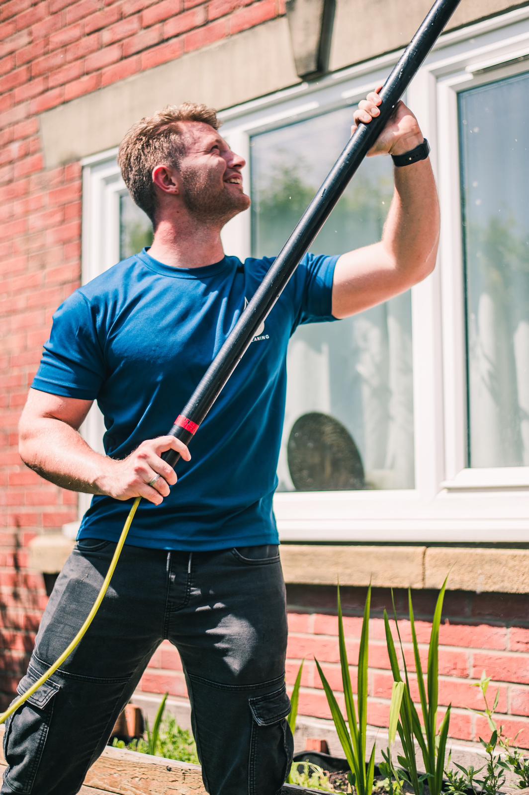 Window cleaner working on a home
